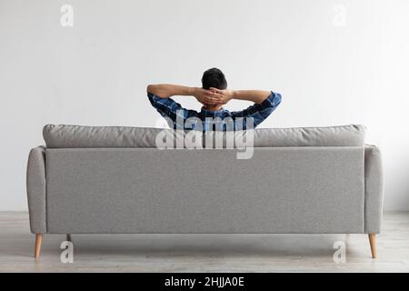 Man having rest at home on the couch Stock Photo