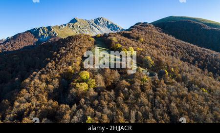 Aerial view of Monte Terminillo in Italy. Beautiful autumn landscape of the Italian central Apennine beech forest. In the background the rocky peak of Stock Photo