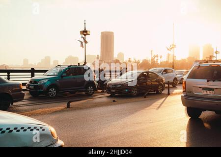 Cairo Egypt December 2021 View of the bridge over the nile river at sunrise. Concepts of traffic and traffic jams in downtown cairo, huge unsolved pro Stock Photo