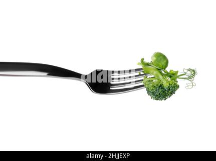 Fork with fresh vegetables on white background Stock Photo