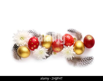 Stylish Easter eggs, flowers and feathers on white background Stock Photo