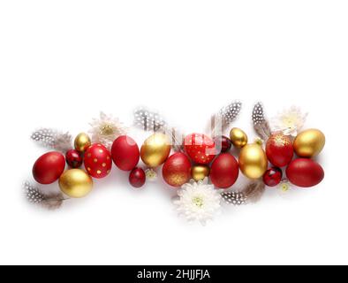 Stylish Easter eggs, flowers and feathers on white background Stock Photo