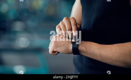Sport Gadgets Concept. Unrecognizable Male Athlete Checking His Fitness Activity On Smartwatch Stock Photo