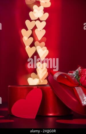 Open heart shaped gift box with heart shaped bokeh lights backgournds Stock Photo