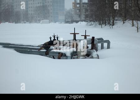 Pipes in winter in city. Sewer unit. Heating equipment. Stock Photo