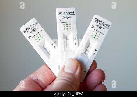 Zellik, Brussels, January 30, 2022. Three positive covid 19 self-tests at your fingertips. Biological examination that can be performed and interprete Stock Photo
