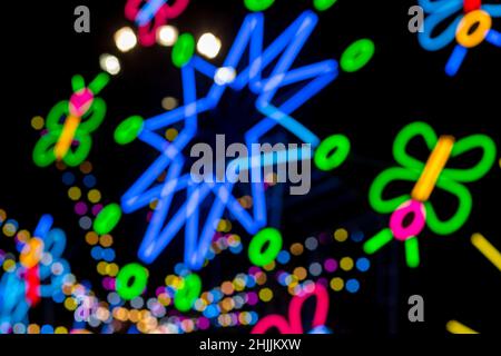 Blured Multi-colored neon lights at night. Stock Photo