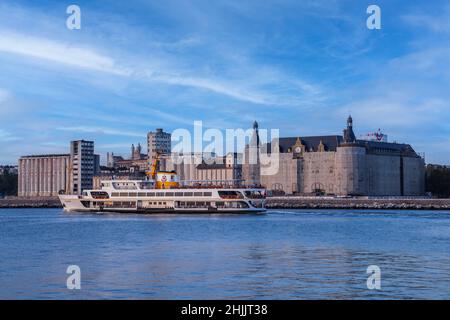 Haydarpaşa station is a railway station in Istanbul Turkey. Bosphorus with a beautiful blue turquoise sky background as the ferry passes in front. Stock Photo