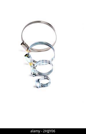 hose clip, round worm tightening clamps on white background, close-up, selective focus Stock Photo