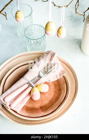 Overhead view of an Easter place setting with painted Easter egg decorations Stock Photo