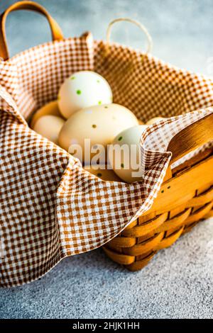 Close-Up of a basket filled with painted Easter eggs Stock Photo
