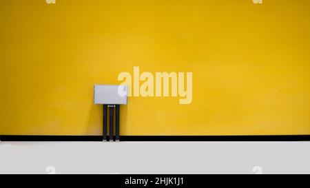 electrical boxes in front of insulated wall Stock Photo