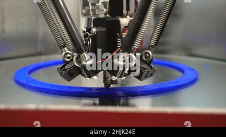 3d printing printer bright model close-up. Media. Automatic 3D printer performs plastic modeling in laboratory. Modern additive technologies, industri Stock Photo