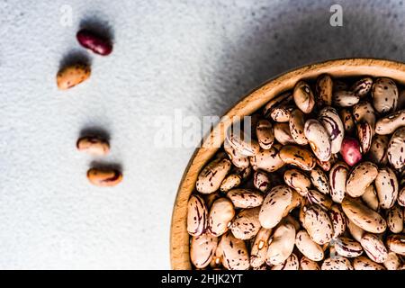 Overhead view of red pinto beans  in a wooden bowl Stock Photo