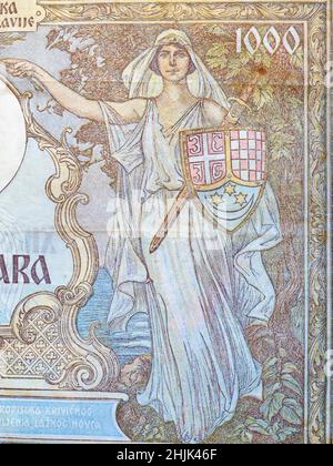 1.000 dinars banknote printed by Yugoslavia that shows a female figure with a sword and a shield Stock Photo