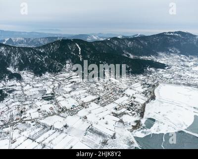 Aerial view of Frozen Golcuk lake and some mountains with Bozdag mountain at Odemis Izmir in winter season. Stock Photo