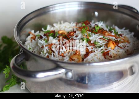 Cottage cheese Biryani or Paneer Biryani inside Biryani pot. Steamed and spiced basmati rice layered with creamy cottage cheese gravy made with cottag Stock Photo