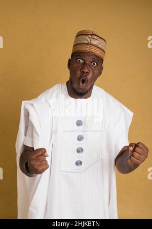 A Traditionally Dressed Northern Business Man Jubilant Stock Photo