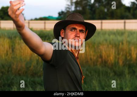 Man in cowboy hat fly hi-res stock photography and images - Alamy