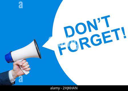 Hand Holding Megaphone With Speech Bubble DONT FORGET!. Announcement. Stock Photo