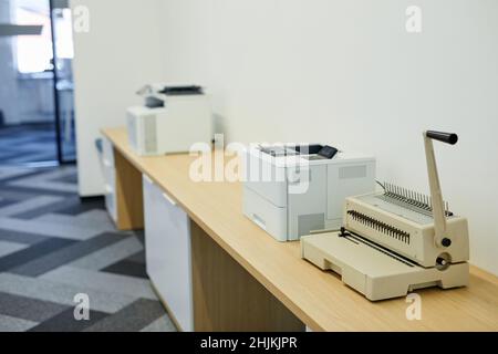 Background image of copying machines and printers set in office interior, copy space Stock Photo
