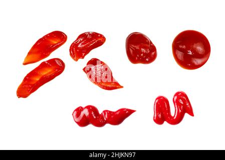 Red sauce splashes isolated on white background. Ketchup. Stock Photo