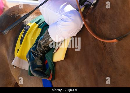 Detail of the boot of a jockey on his horse waiting to the beginning of the local derby Stock Photo