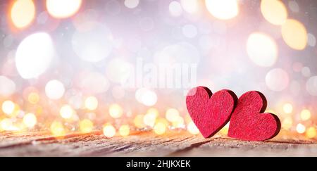 Valentine's Day - Wooden Hearts With Defocused Blurred Lights Stock Photo