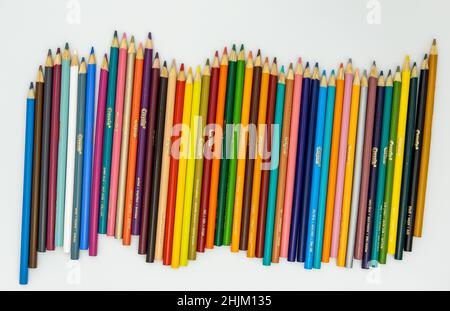 Colored wooden sharp pencils on a white background. Stock Photo