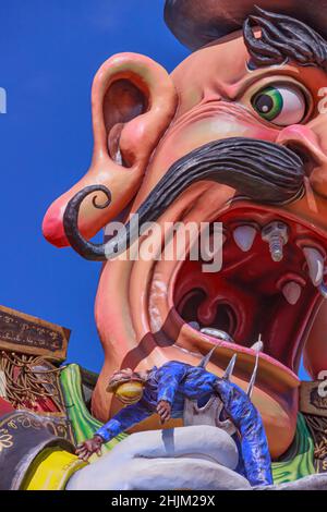 Putignano, Apulia, Italy - February 15, 2015: carnival floats, giant paper mache. Allegorical float of Ilva industry: death at work. Stock Photo