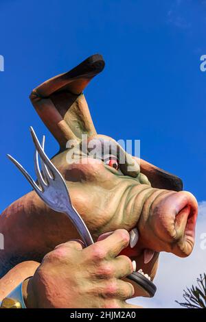Putignano, Apulia, Italy - February 15, 2015: carnival floats, giant paper mache. Allegorical float:pig with forks. Stock Photo