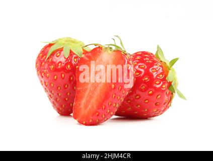 Whole and sliced strawberries isolated on white background. Healthy fruit Stock Photo