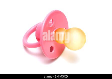 Baby pink mannequin isolated on a white background. Pink babys pacifier isolated on white background. Stock Photo