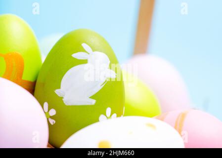 Easter Eggs. Easter eggs in basket. Colorful easter eggs background. Stock Photo