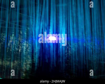 Cyan Vertical Lines with a Black Background and Reflectors Stock Photo