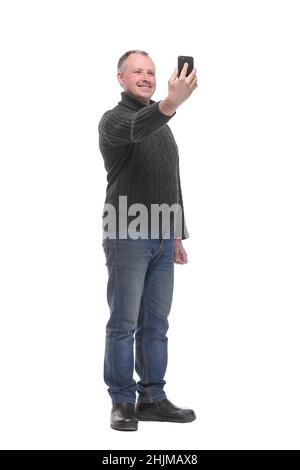 Photo of cheerful man isolated over white background make selfie by mobile phone Stock Photo