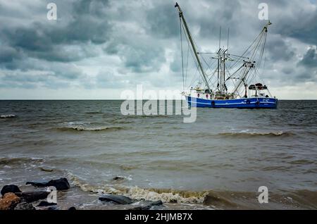 A shrimp boat heads out into the Gulf of Mexico, May 16, 2015, in Bayou La Batre, Alabama. The city is known as the Seafood Capital of Alabama. Stock Photo