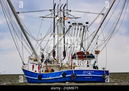 A shrimp boat heads out into the Gulf of Mexico, May 16, 2015, in Bayou La Batre, Alabama. The city is known as the Seafood Capital of Alabama. Stock Photo