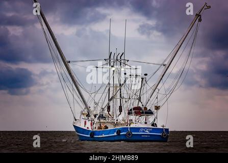 A shrimp boat heads out into the Gulf of Mexico, May 16, 2015, in Bayou La Batre, Alabama. The city is known as the Seafood Capital of Alabama. Stock Photo