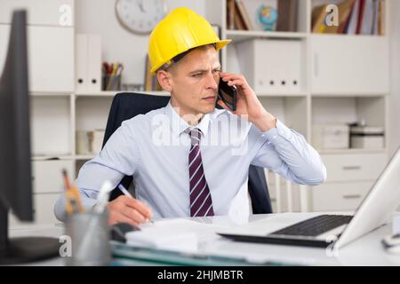 Portrait of american architect in yellow hard-hat Stock Photo