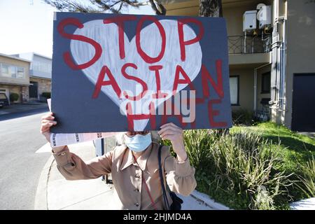 San Francisco, United States. 30th Jan, 2022. A woman seen holding a placard that says 'Stop Asian Hate' during the Asian Justice Rally.Some Asian organizations held a rally in five cities of the United States demanding justice for Asian-American crime victims. These five cities are Los Angeles, New York, San Francisco, Chicago and Atlanta. In San Francisco, around two hundred people took part in a rally, including the mayor of San Francisco, London Breed. The participants also commemorated Vicha Ratanapakdee death anniversary. Credit: SOPA Images Limited/Alamy Live News Stock Photo
