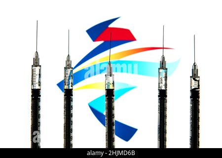 In this photo illustration medical syringes seen with a Winter Olympics Games Beijing 2022 logo in the background. Stock Photo