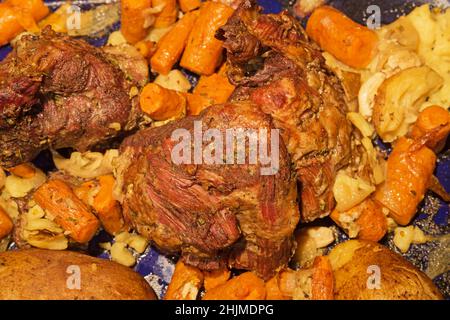 boneless lamb leg roasted with potatoes and carrots Stock Photo