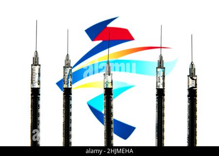 Spain. 24th Jan, 2022. In this photo illustration medical syringes seen with a Winter Olympics Games Beijing 2022 logo in the background. (Credit Image: © Thiago Prudencio/SOPA Images via ZUMA Press Wire) Stock Photo