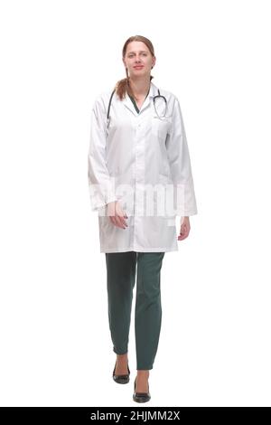 female doctor walking towards the camera smiling isolated Stock Photo