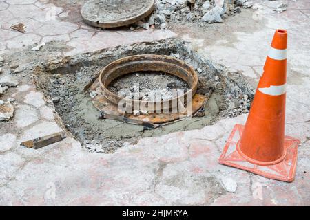 open manhole and repair and replacement of roads background Stock Photo