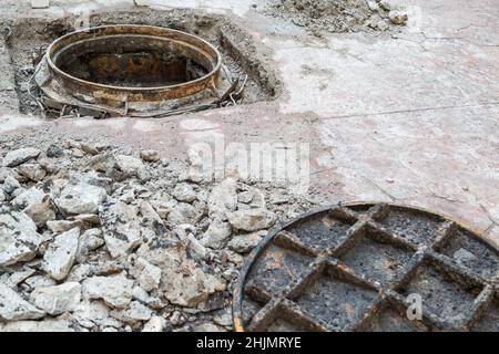 open manhole and repair and replacement of roads background Stock Photo