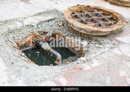 open manhole and repair and replacement of roads background Stock Photo