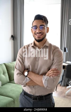 Portrait of smart indian business man looking at camera at home office Stock Photo