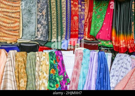 Colourful fabrics on sale at Dubai Textile Souk in Dubai, United Arab Emirates. Stock Photo